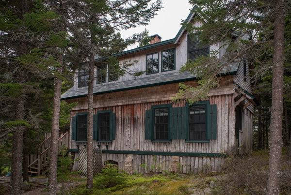 The rustic exterior design of a Claremont Hotel C2 Cottage in Southwest Harbor, Maine.