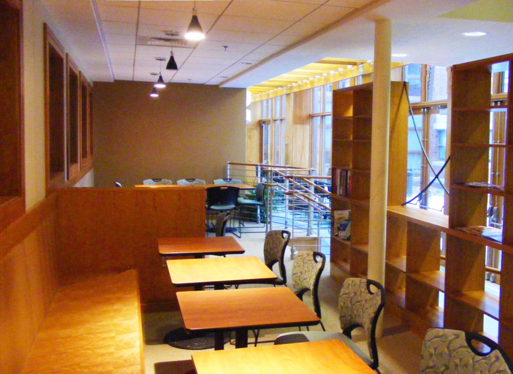 A seating area in the Oasis Café showing the interior design of the project.