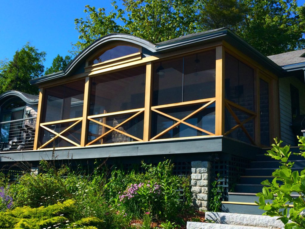 The Seal Cove cottage’s new porch viewed from the shore of the cove.