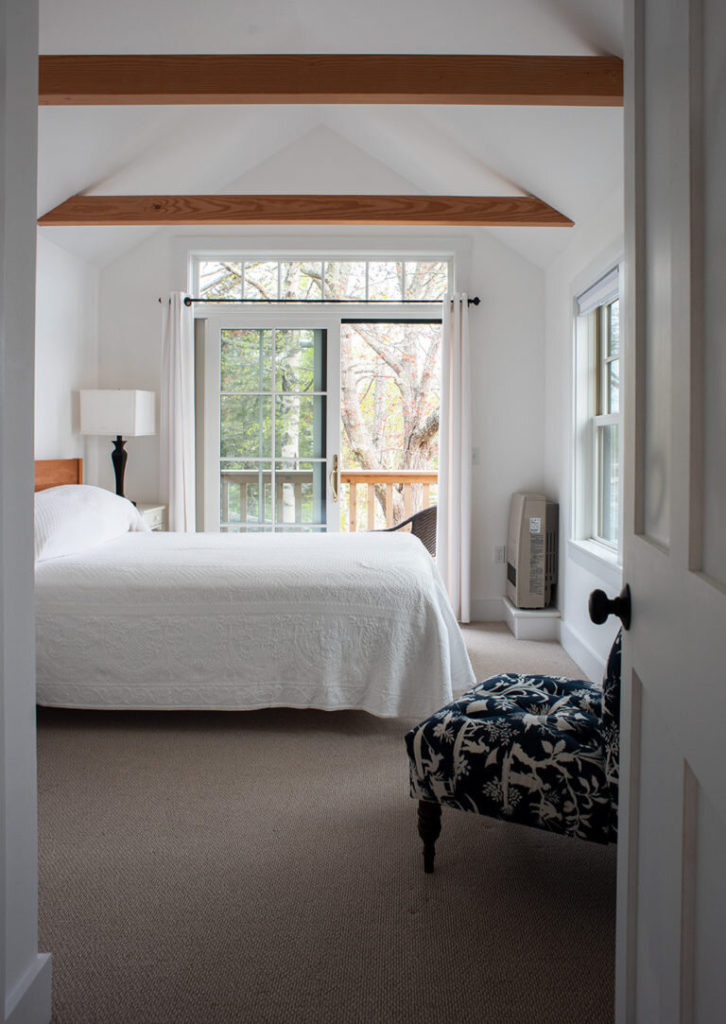 A spacious bedroom in the Claremont Hotel ALM Cottage.