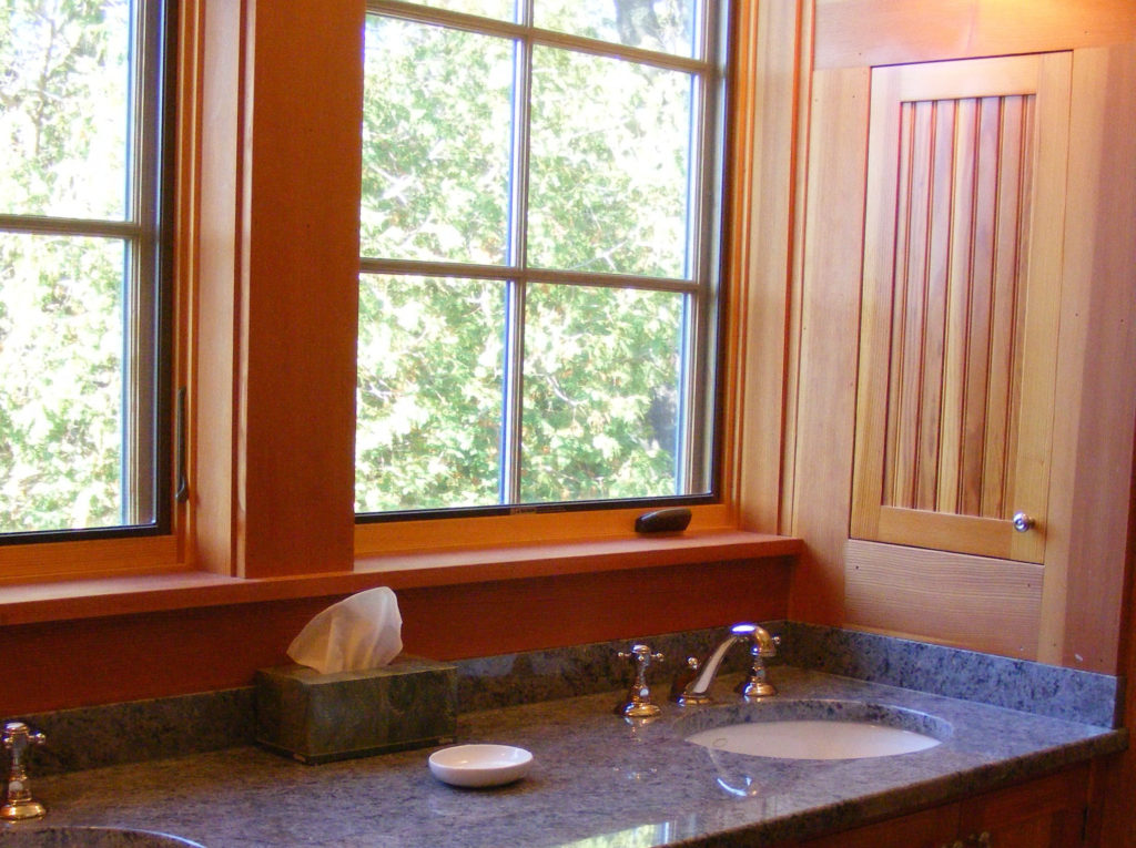 Douglas Fir paneling and granite countertops in the master bathroom.