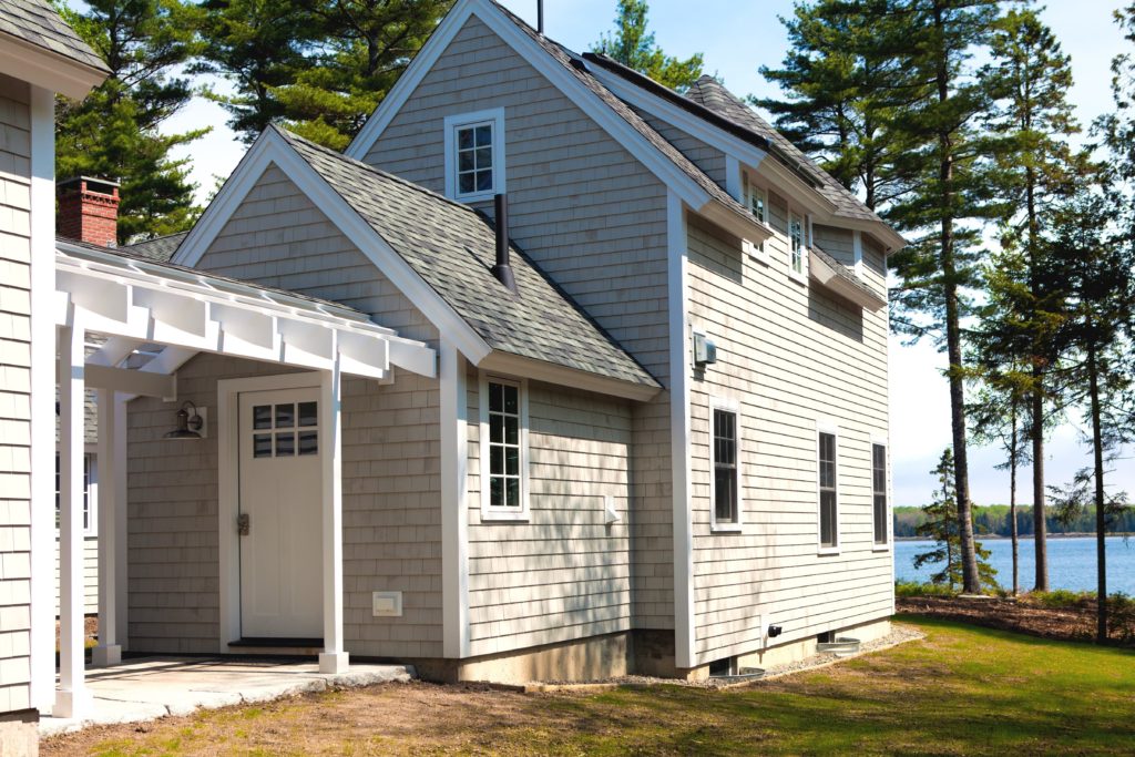 An exterior view of Sunnybrae overlooking the water.