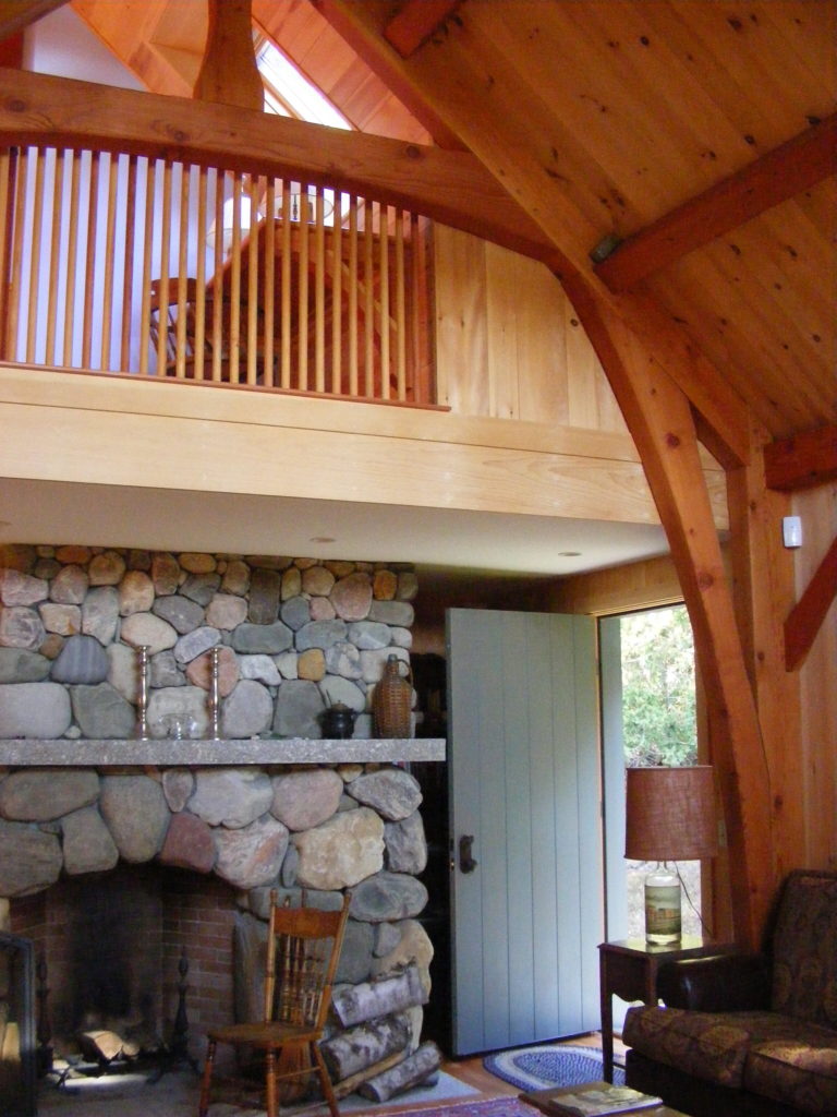 A fireplace made with colorful stones in Island Cove Cottage.